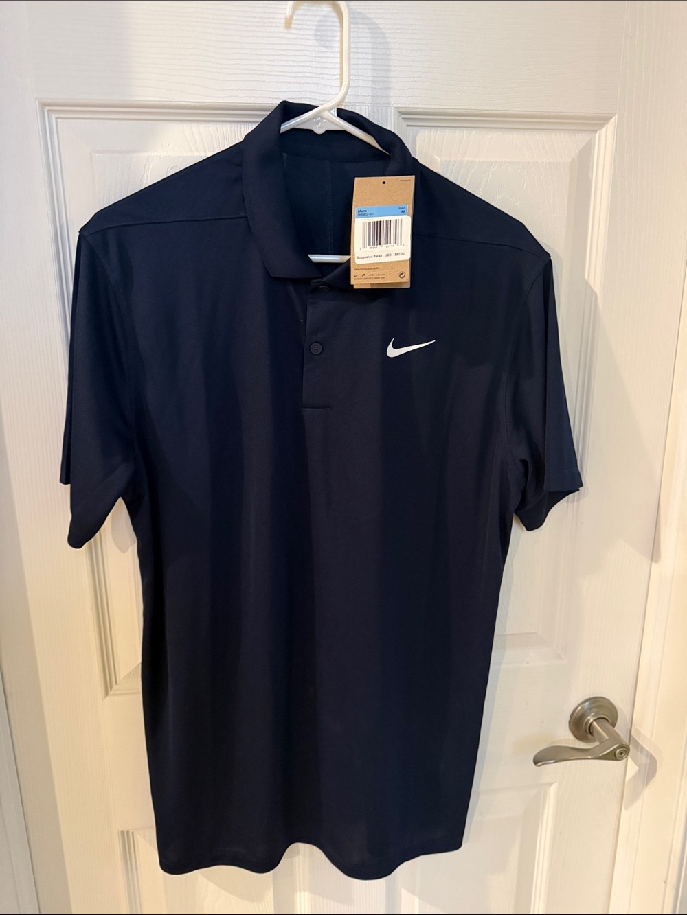 Nike Men’s Navy Polo with White Swoosh
